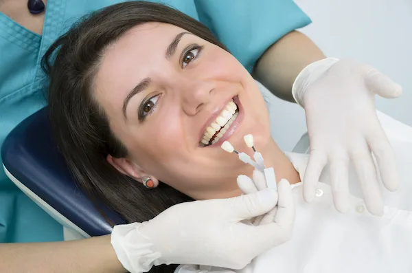 A Woman checks if she is a good candidate for dental implants