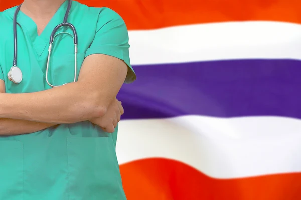 Male surgeon stethoscope on the background of the Thailand flag.