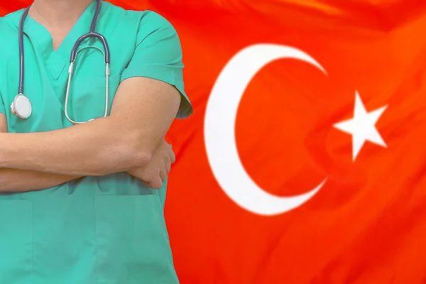  Male surgeon with stethoscope on the background of the Turkey flag.
