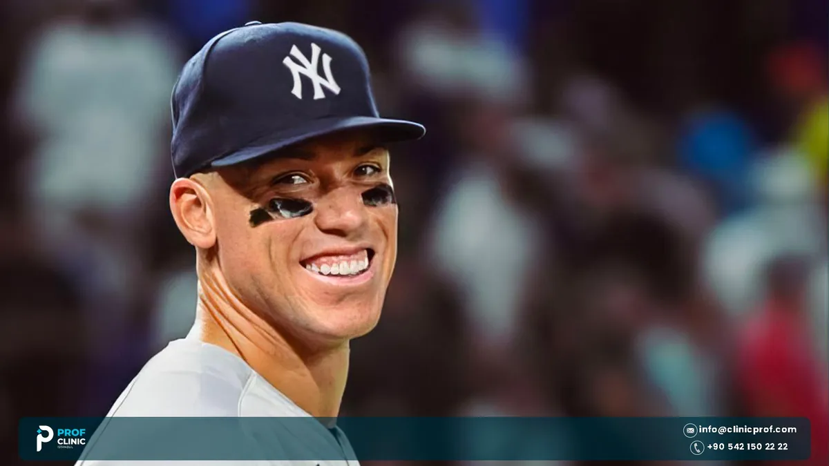 Aaron Judge smiling in a dugout close-up