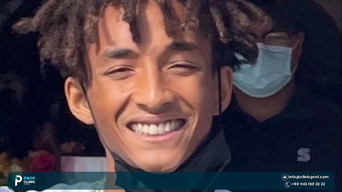 Jaden Smith teeth feature: portrait of him smiling, face mask pulled below chin