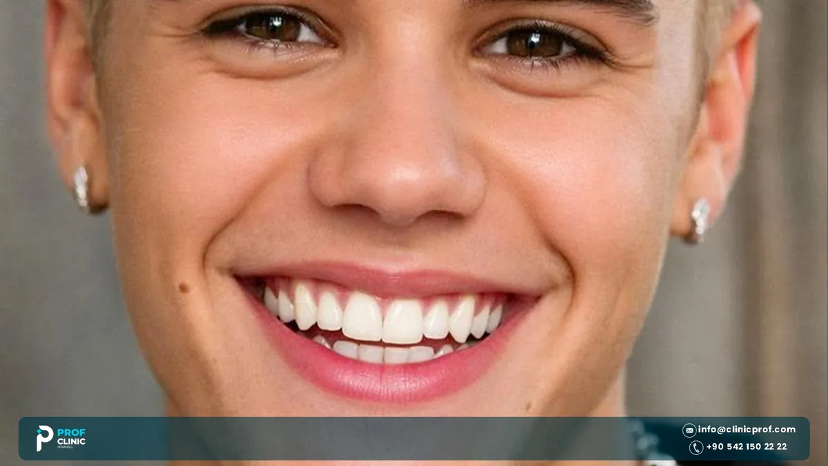 Close-up of Justin Bieber smiling, showing his upper teeth