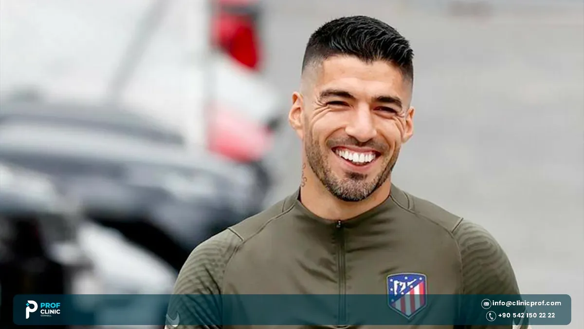 Luis Suarez smiling in an Atletico Madrid training top