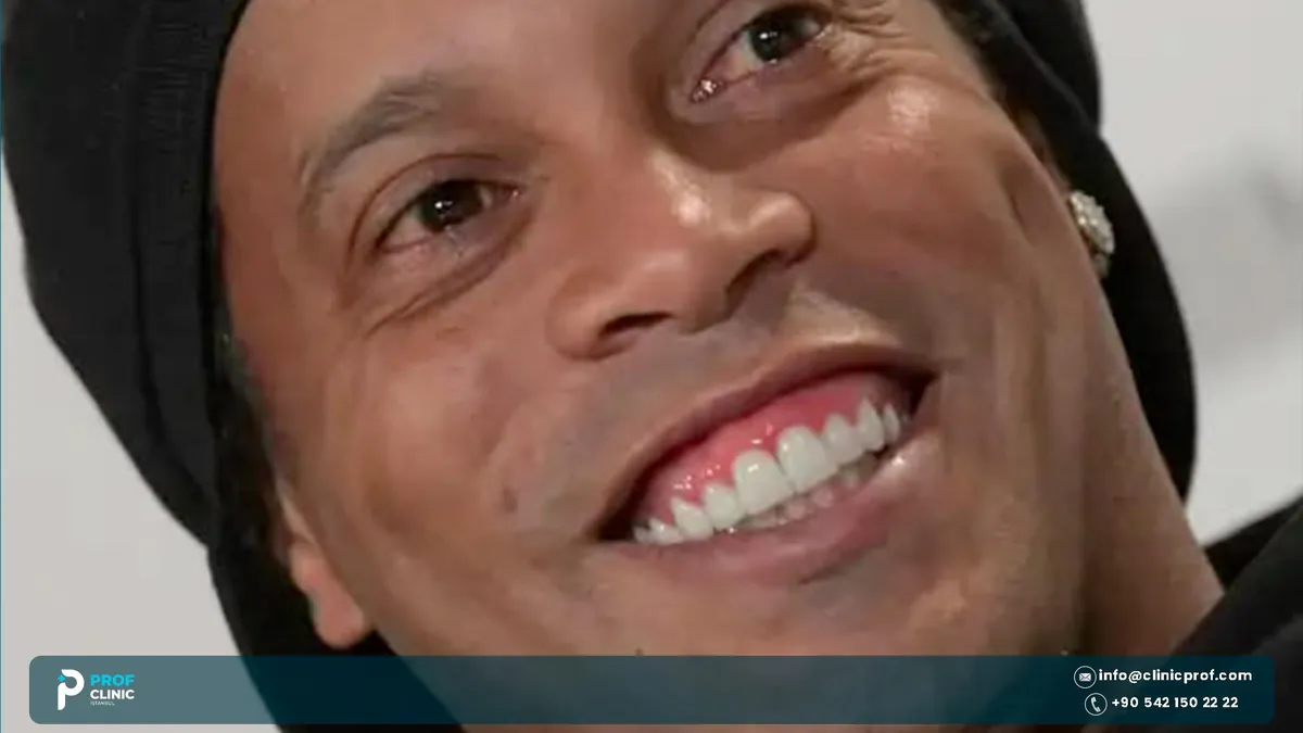 Close-up of Ronaldinho smiling in a black cap