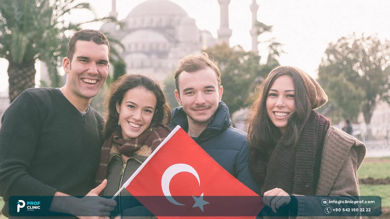 Group of four young people holding a Turkish flag